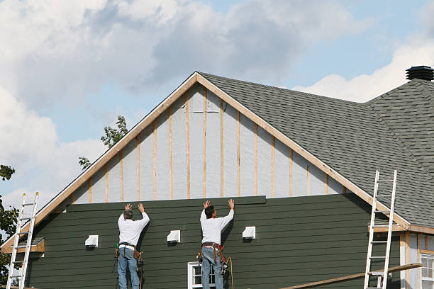 Professional Siding technician working in Grand River, OH